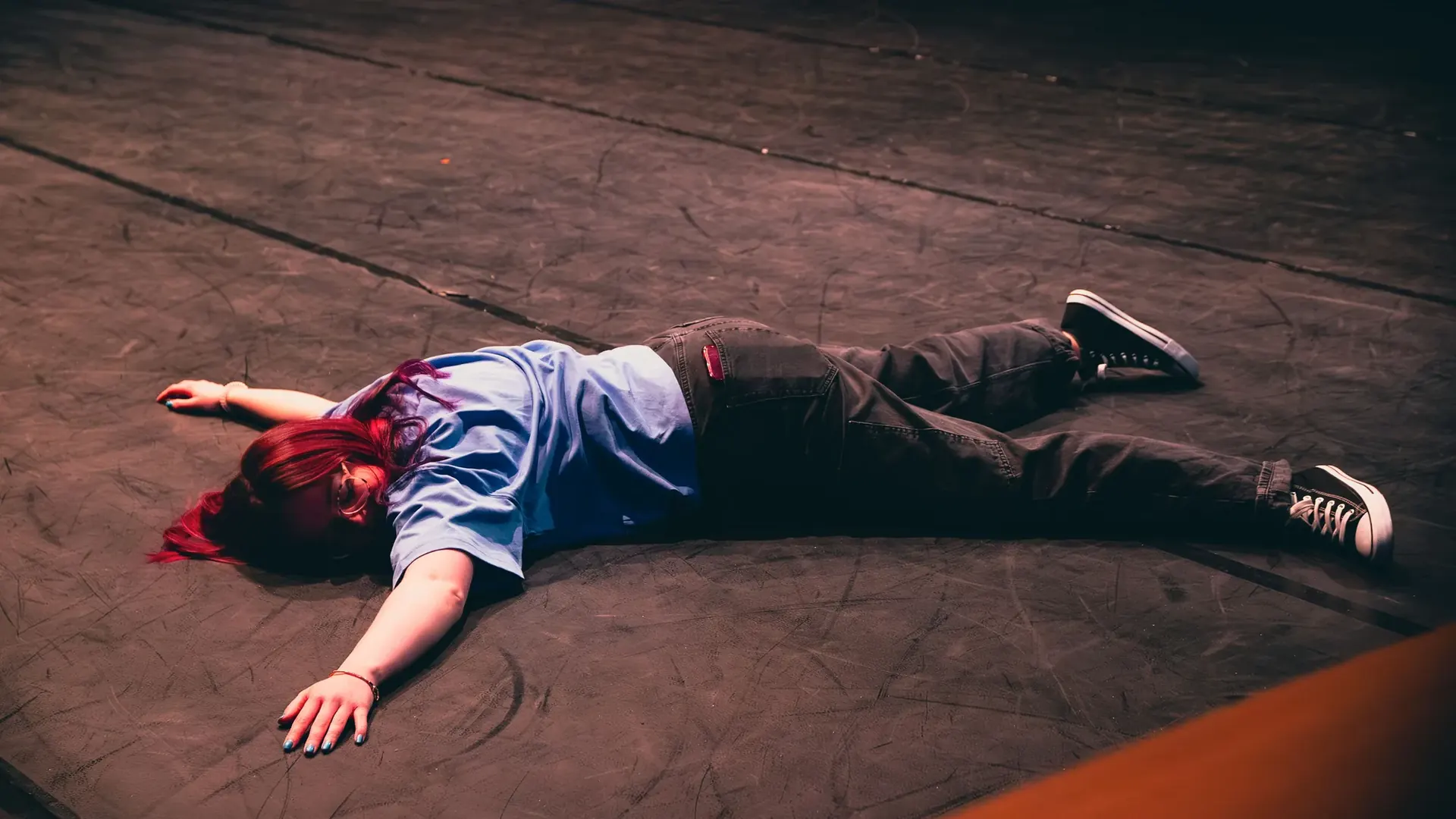 Performer lying across the stage during 30 Day Free Trial