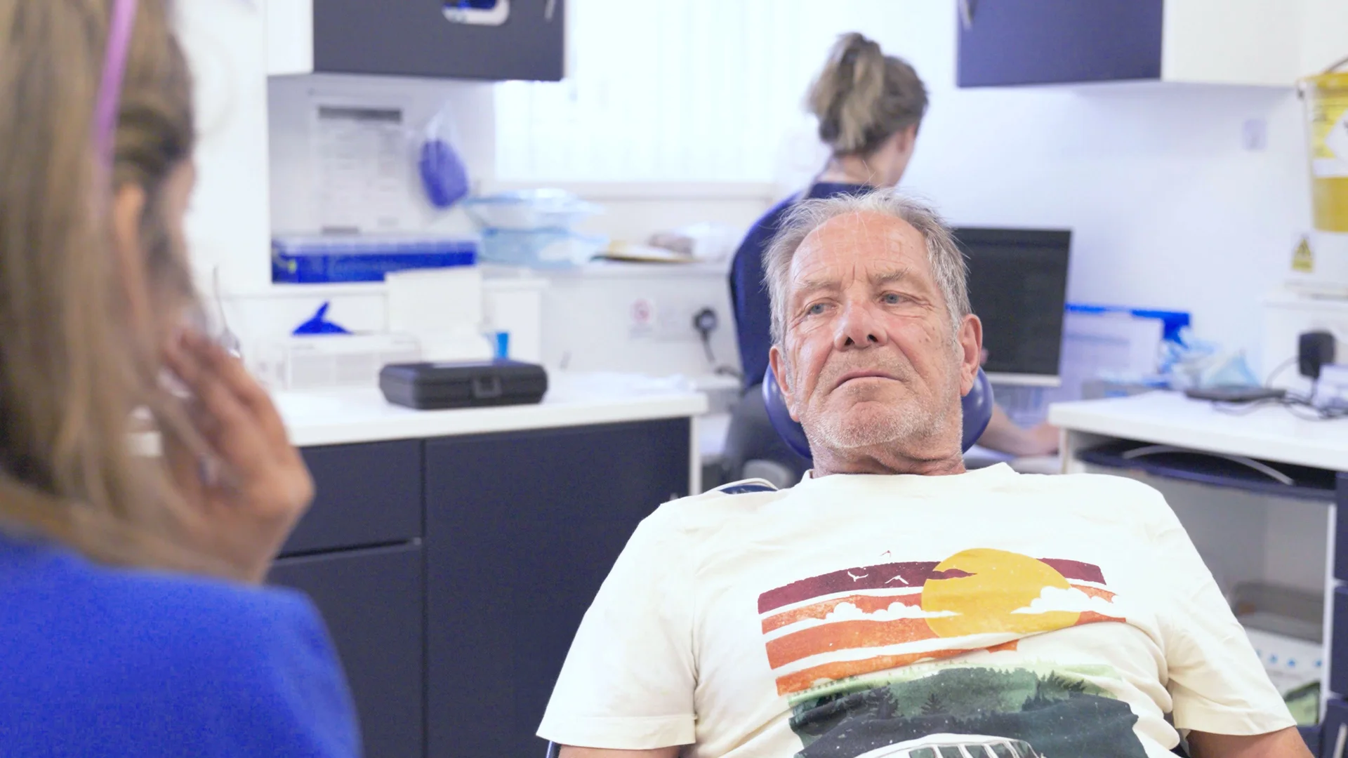 Patient seated in a Genix Healthcare treatment room