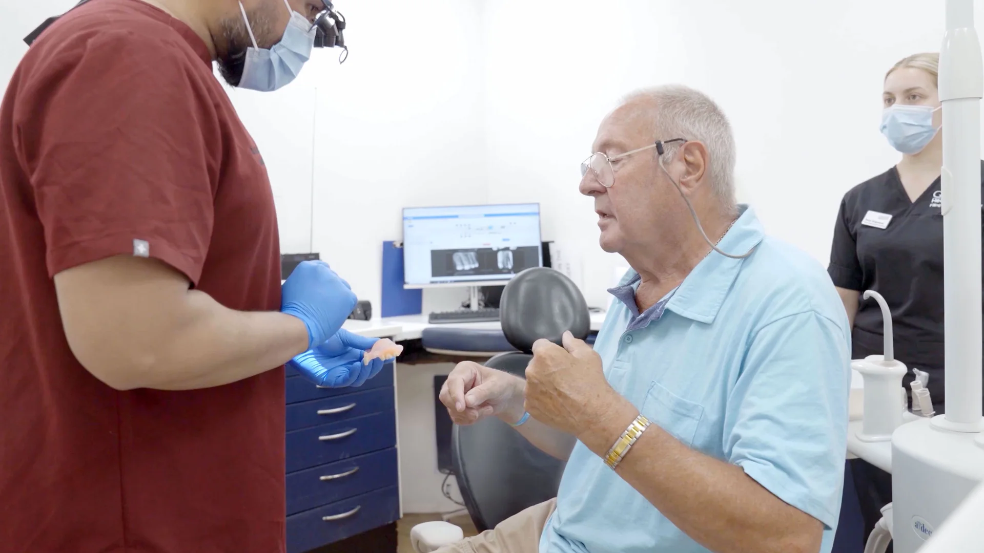 Genix Healthcare team member speaking with a patient