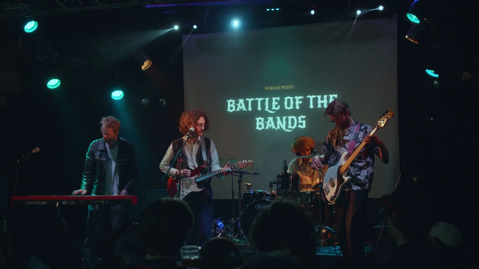 Full band performing at Battle of the Bands