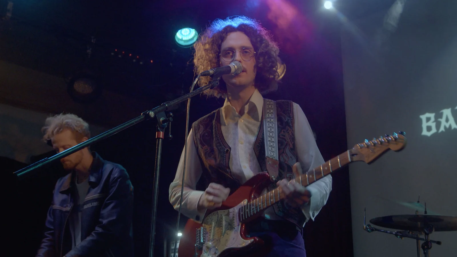 Singer and guitarist performing at Battle of the Bands