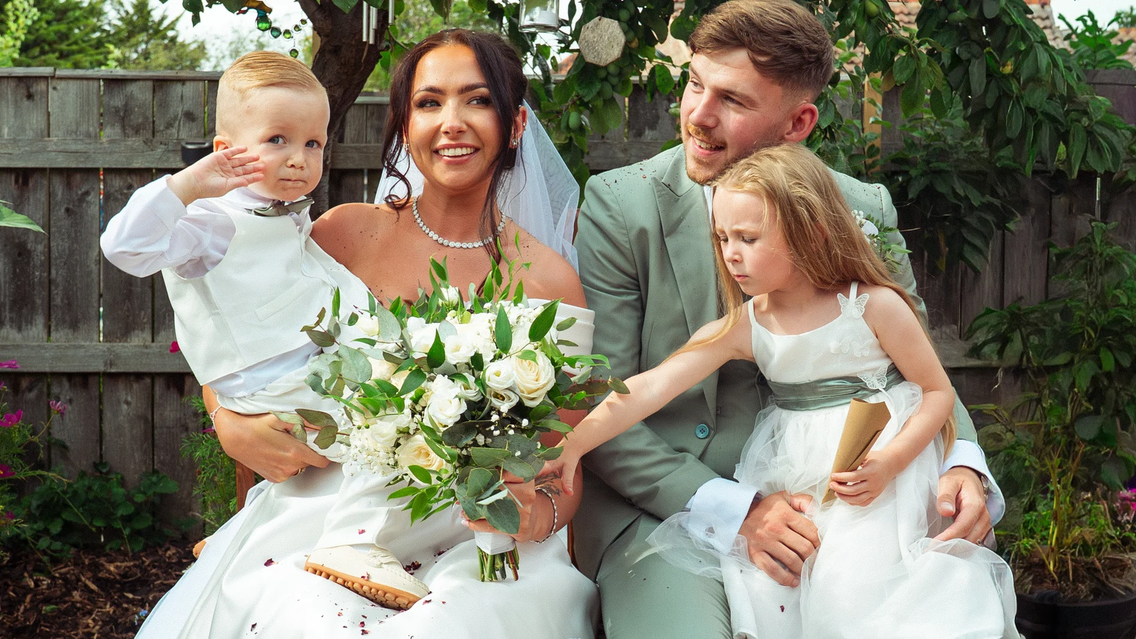 Newlyweds with children after the ceremony