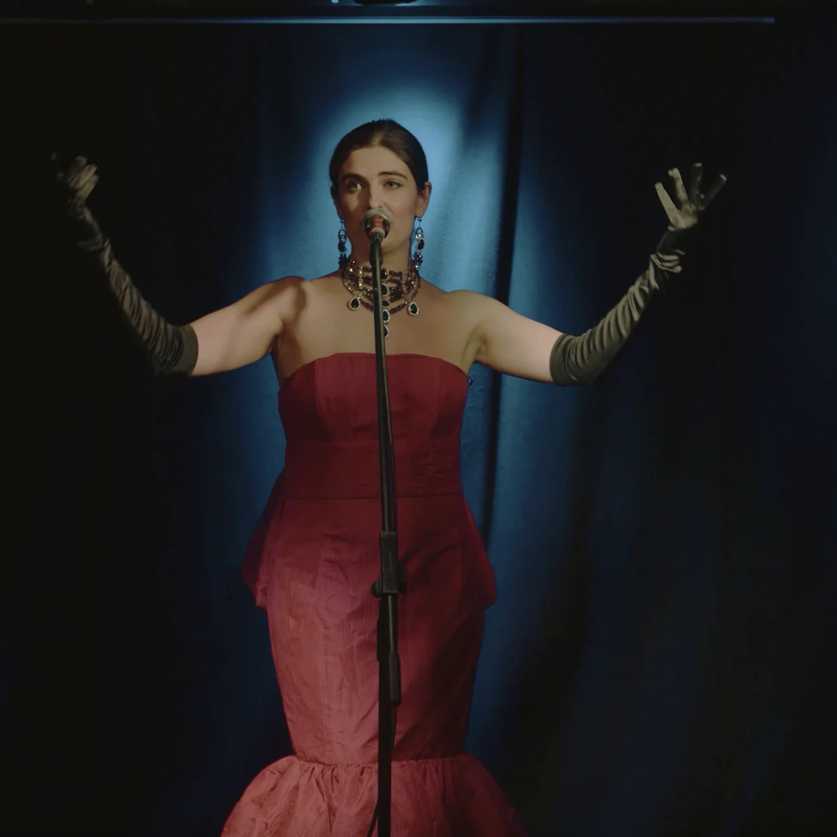 Generika performing in a red gown