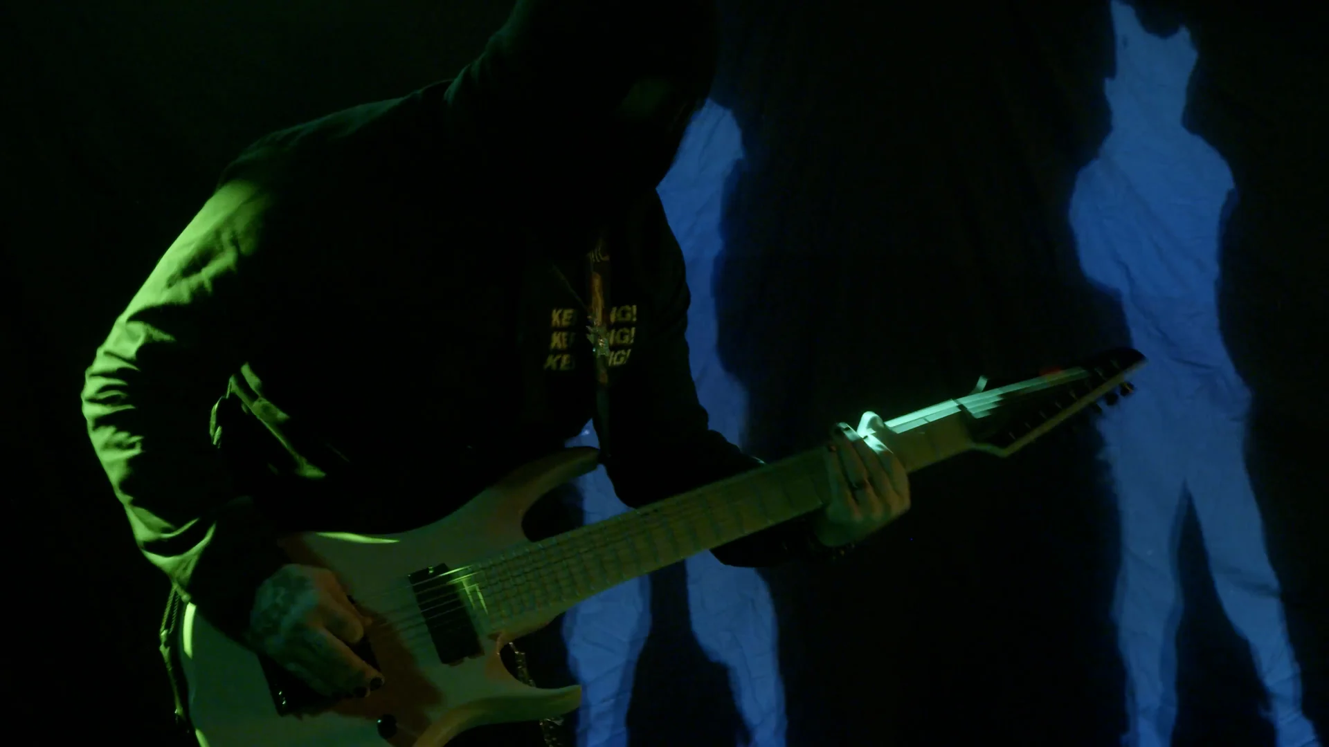 Monarkki performance under stage lighting