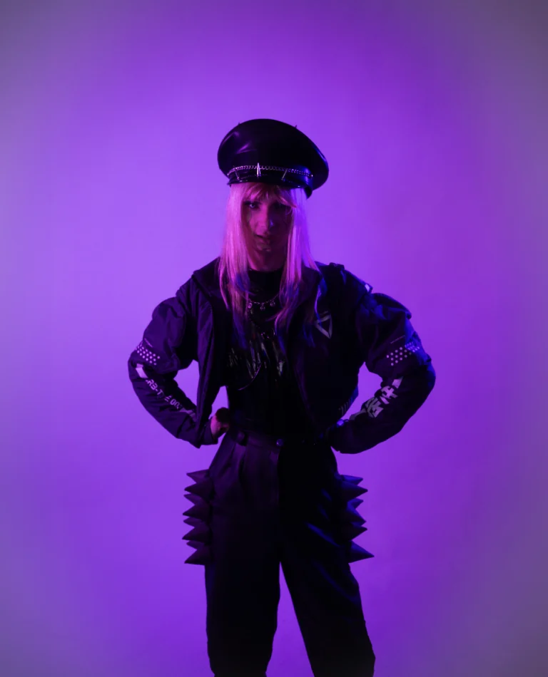 Monarkki portrait under coloured studio lighting