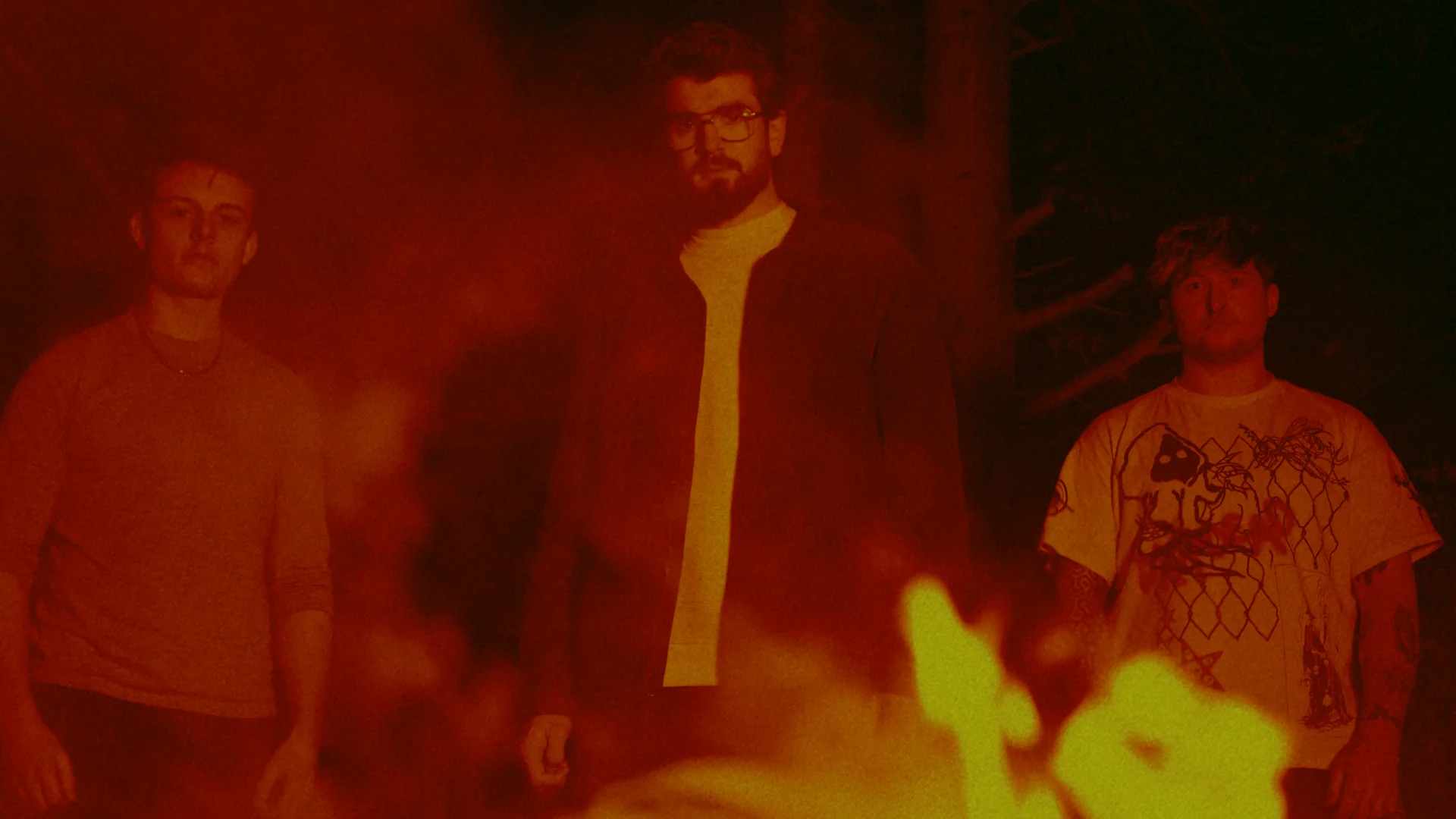 King Fuzz standing behind flames in the I See Red music video