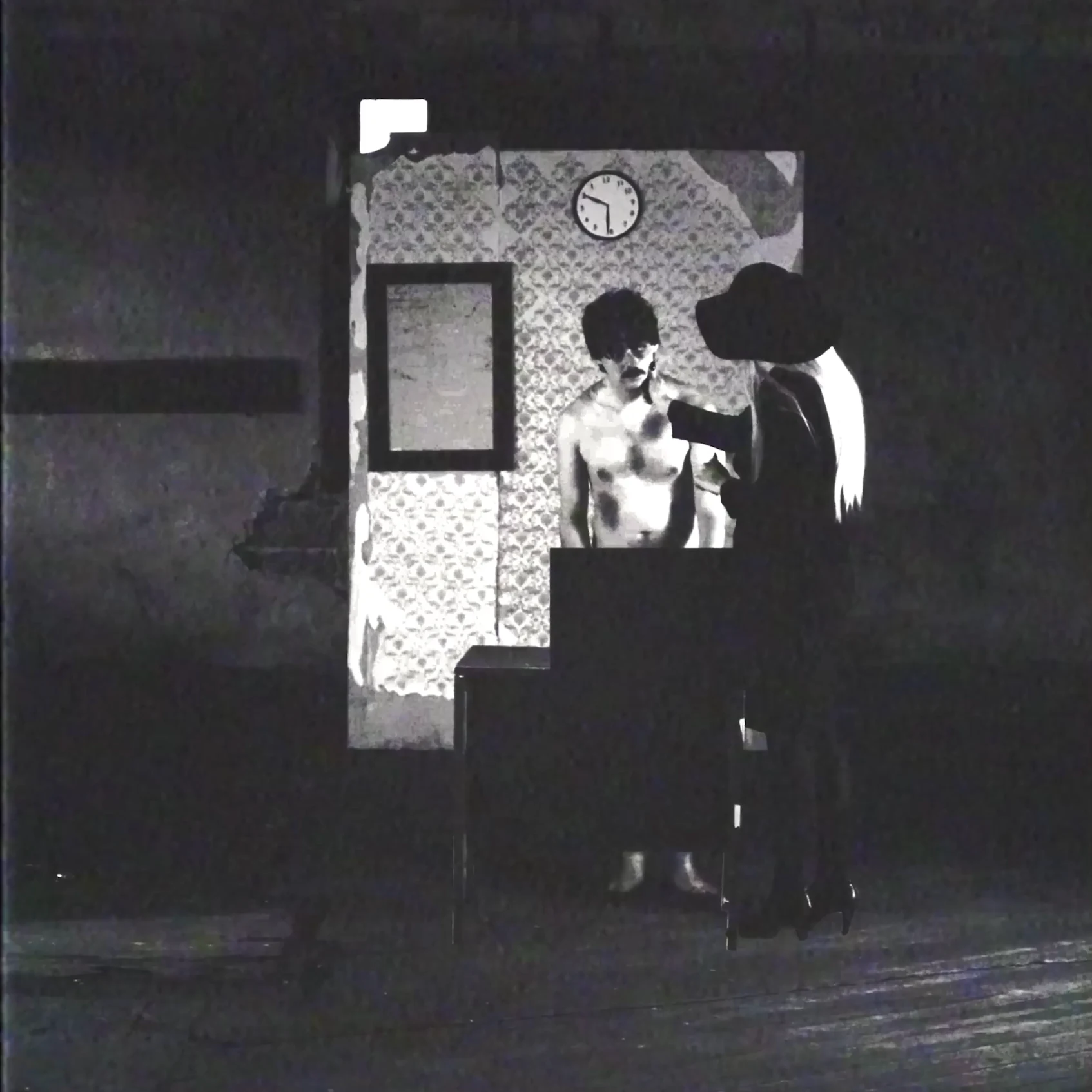 Answer The Telephone v7.1 square still with Adam standing inside the experiment space