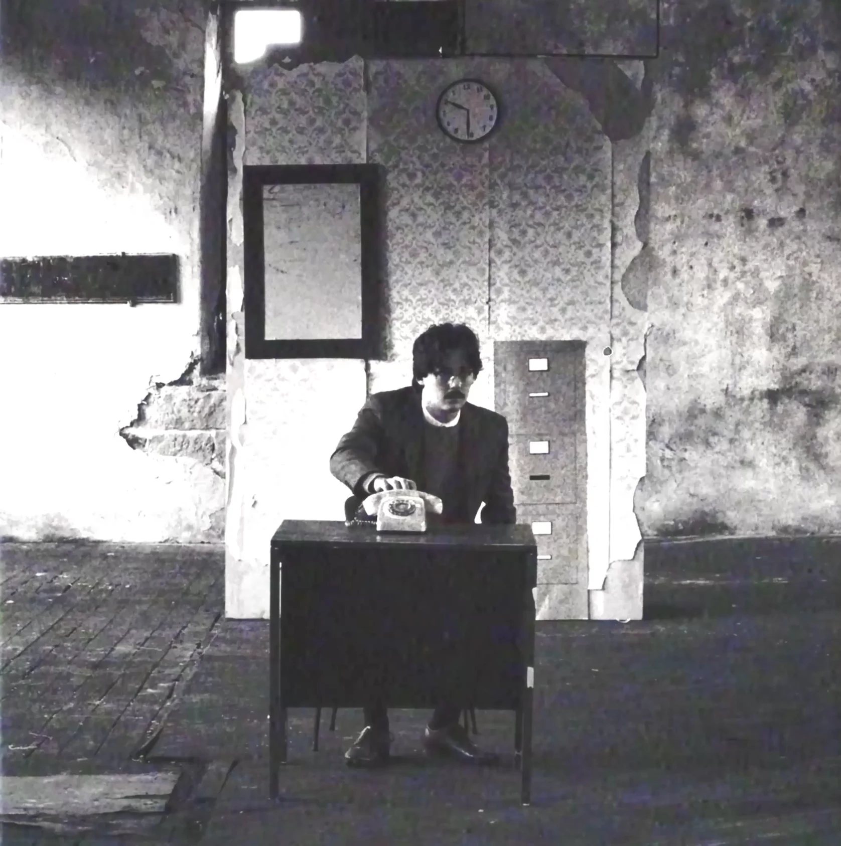 Answer The Telephone v7.1 square still of Elizabeth instructing Adam at the desk
